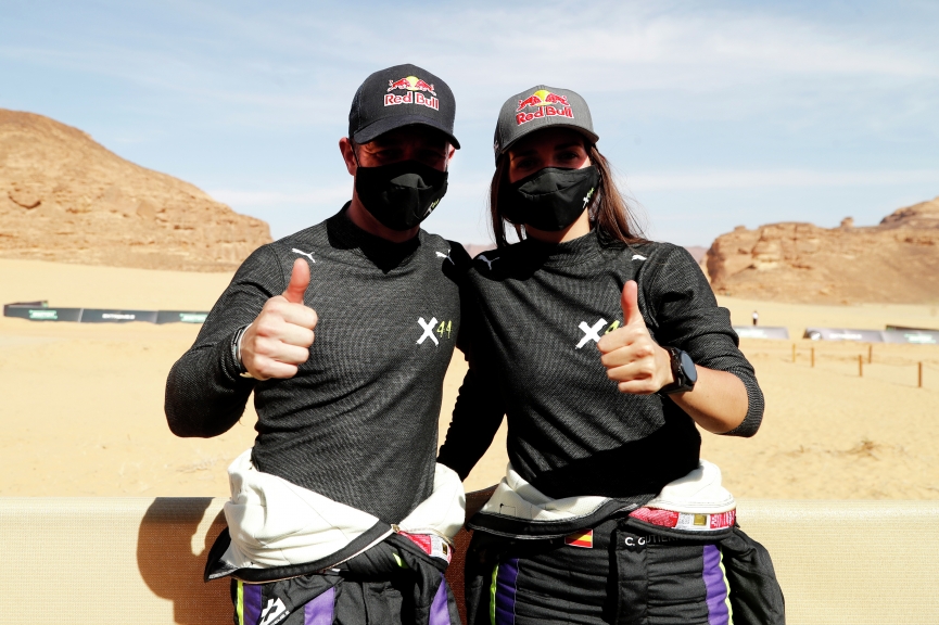 ALULA, SAUDI ARABIA - APRIL 03: Sebastien Loeb (FRA), X44, and Cristina Gutierrez (ESP), X44, celebrate being fastest at the end of qualifying during the Desert X-Prix at AlUla on April 03, 2021 in AlUla, Saudi Arabia. (Photo by Steven Tee / LAT Images)