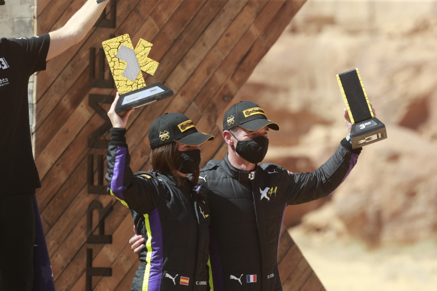 ALULA, SAUDI ARABIA - APRIL 04: Cristina Gutierrez (ESP)/Sebastien Loeb (FRA), X44 on podium with trophy during the Desert X-Prix at AlUla on April 04, 2021 in AlUla, Saudi Arabia. (Photo by Steven Tee / LAT Images)
