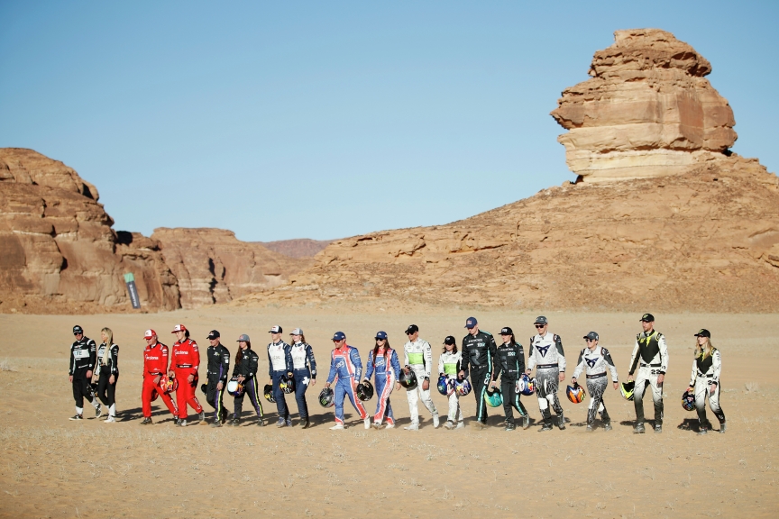 ALULA, SAUDI ARABIA - APRIL 01: (L-R) Oliver Bennett (GBR), Hispano Suiza Xite Energy Team, Christine 'GZ' Giampaoli Zonca (ESP), Hispano Suiza Xite Energy Team, Carlos Sainz (ESP), Acciona | Sainz XE Team, Laia Sanz (ESP), Acciona | Sainz XE Team, Cristina Gutierrez (ESP), X44, Sebastien Loeb (FRA), X44, Timmy Hansen (SWE), Andretti United Extreme E, Catie Munnings (GBR), Andretti United Extreme E, Kyle Leduc (USA), Segi TV Chip Ganassi Racing, Sara Price (USA), Segi TV Chip Ganassi Racing, Stephane Sarrazin (FRA), Veloce Racing, Jamie Chadwick (GBR), Veloce Racing, Johan Kristoffersson (SWE), Rosberg X Racing, Molly Taylor (AUS), Rosberg X Racing, Mattias Ekstrom (SWE), ABT CUPRA XE, Claudia Hurtgen (GER), ABT CUPRA XE, Jenson Button (GBR), JBXE Extreme-E Team, and Mikaela Ahlin-Kottulinsky (SWE), JBXE Extreme-E Team during the Desert X-Prix at AlUla on April 01, 2021 in AlUla, Saudi Arabia. (Photo by Zak Mauger / LAT Images)