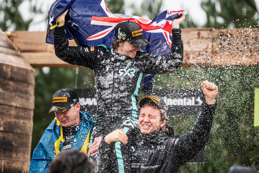 DECEMBER 19: Johan Kristoffersson (SWE), Rosberg X Racing, Molly Taylor (AUS), Rosberg X Racing, and Nico Rosberg, founder and CEO, Rosberg X Racing, celebrate winning the championship on the podium during the Jurassic X-Prix on December 19, 2021. (Photo by Charly Lopez / LAT Images)